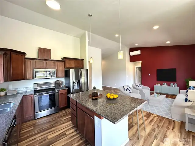 Photo is of virtually staged kitchen/living area
