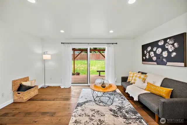Let natural light pour in as you relax in this cheerful living area with direct access to the backyard for easy indoor-outdoor living.