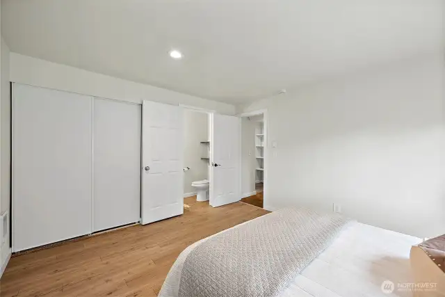Thoughtfully designed with function and flow in mind, the ensuite includes access to both the private bath and generous closet space.