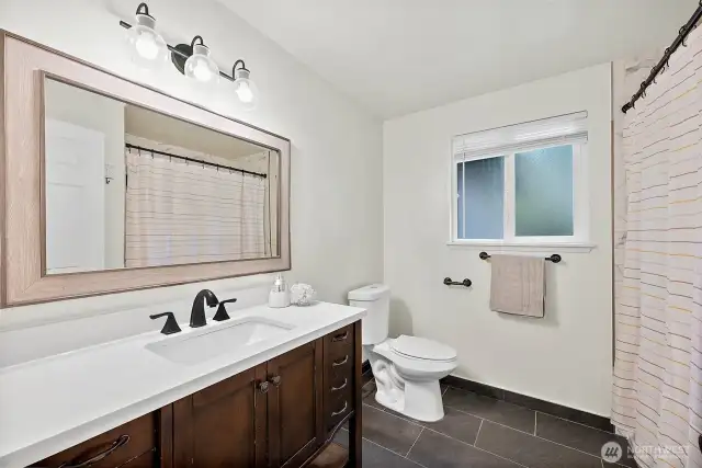 Fresh and updated, the bathroom offers a place to start or end your day, with updated finishes and a clean, calming palette.