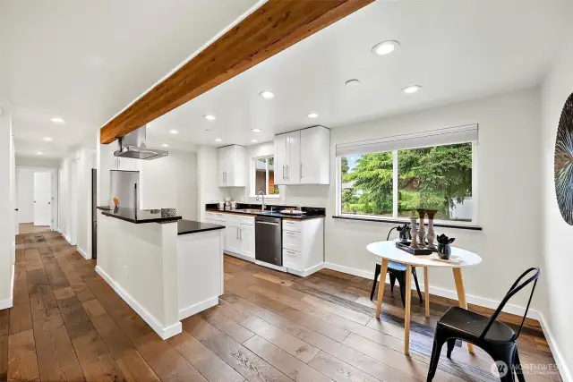 This open layout makes gatherings and everyday living a breeze. Engineered hardwood floors and tons of natural lighting make it feel both stylish and relaxed.