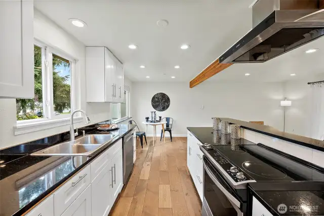 This bright, inviting kitchen is a joy to cook in, with natural light pouring in and plenty of space to spread out and enjoy your morning coffee or prep a favorite recipe.