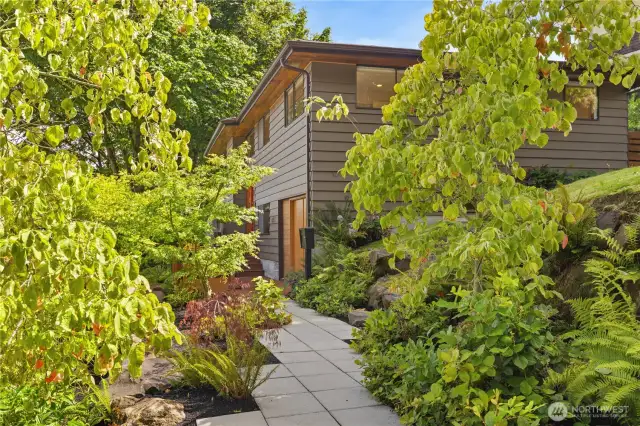 Lush gardens welcome you home.