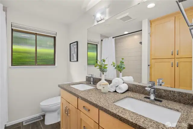 Main level full bathroom with tons of storage.