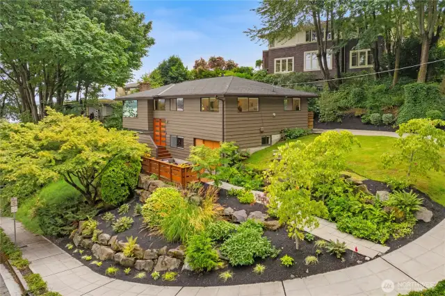 Professionally crafted rock walls and low maintenance plantings.