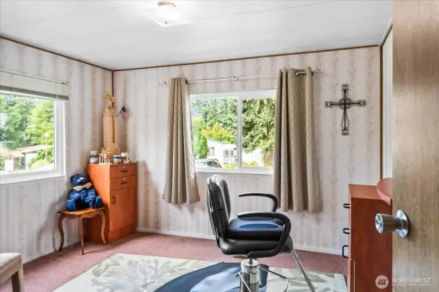One of 2 guest rooms that can be used for an office or in this case, an in home business
