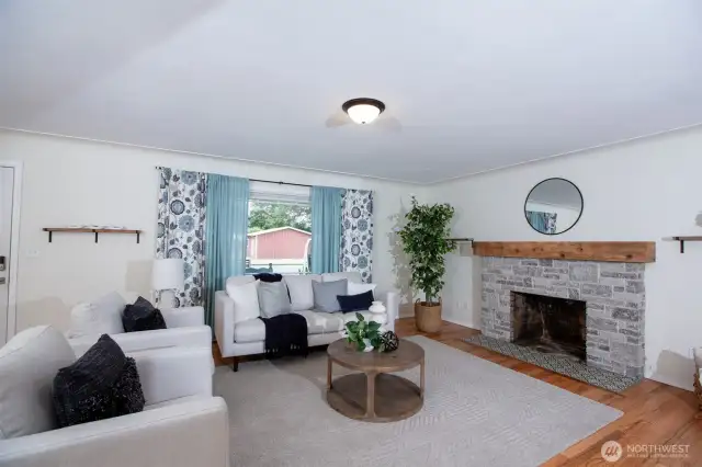 Original sandstone fireplace adds character to this spacious inviting living room.