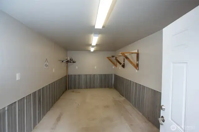 Workshop with concrete floor is finished and has power.