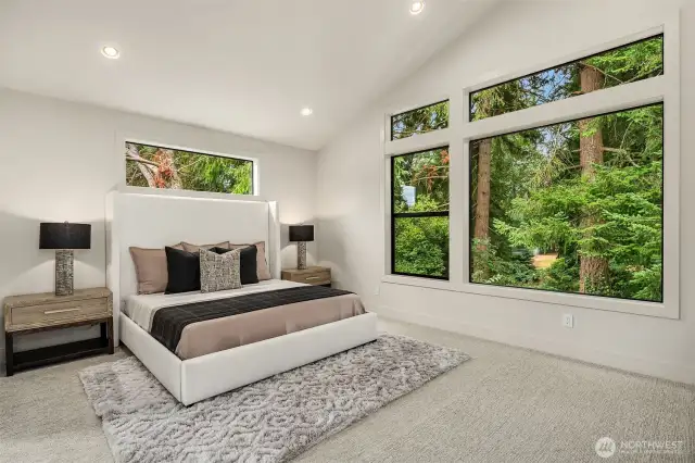 Designer primary suite with five-piece bath with heated floors