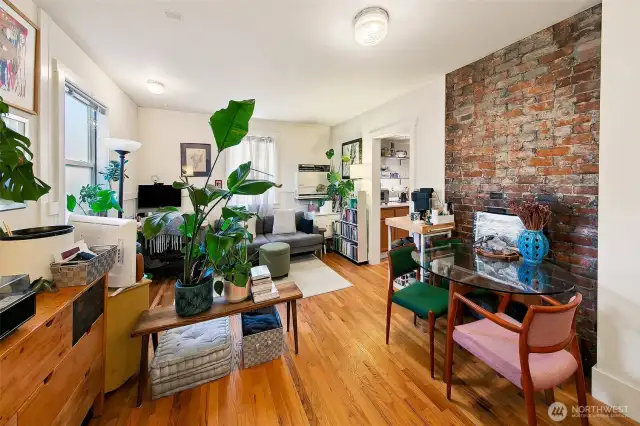 Apartment 5 – Ground-Floor Gem with Garden Outlook  Apartment 5 makes the most of its position with leafy views, warm morning light, and rich historic details—including a full exposed brick wall and original wood floors. Tidy yet expressive, this unit has attracted long-term residents who value both privacy and personality. A peaceful back-of-building unit with easy access to the shared laundry and private outdoor deck.