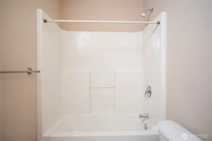 Guest bath tub with shower