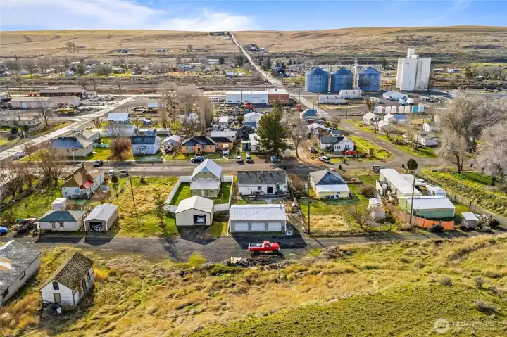 The lot behind the shop (see the red truck) is included with the sale.