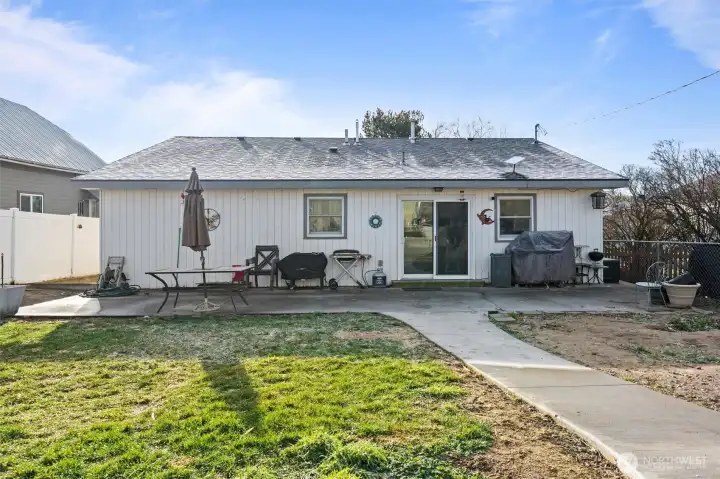 Backyard large patio and walkway to the shop and back lot