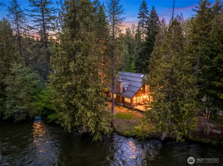 Private Chiwawa River frontage creates a true mountain retreat setting, surrounded by towering evergreens and the soothing sound of flowing water. Private Chiwawa River frontage creates a true mountain retreat setting, surrounded by towering evergreens and the soothing sound of flowing water.