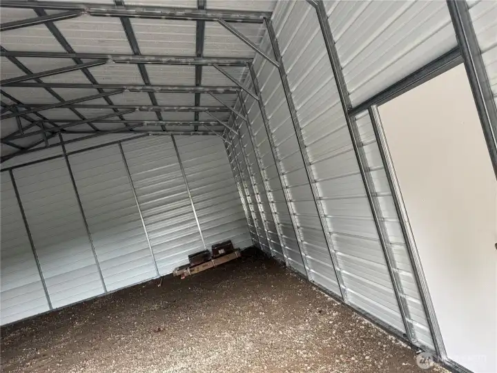 INSIDE METAL SHOP --- Man Door on right