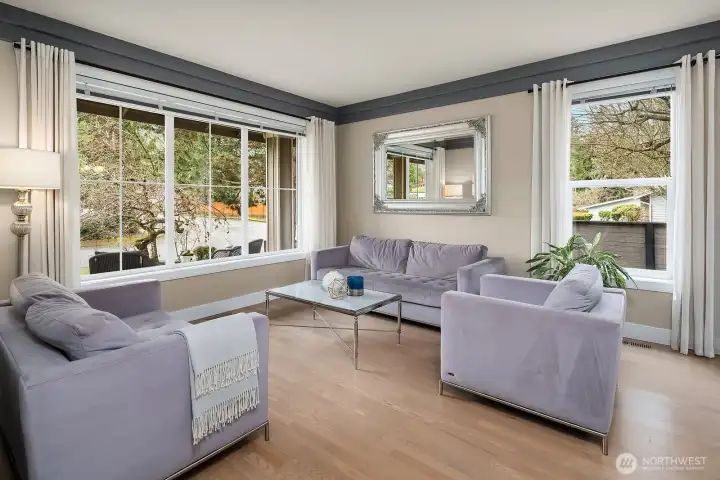 An OPEN + BRIGHT Living & Dining Room welcome your guests in style.