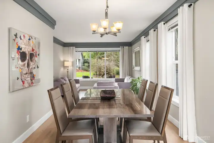 An OPEN + BRIGHT Living & Dining Room welcome your guests in style.