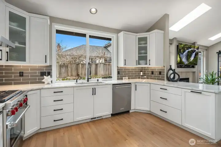 Wolf & KitchenAid appliances+beverage cooler and microwave drawer.