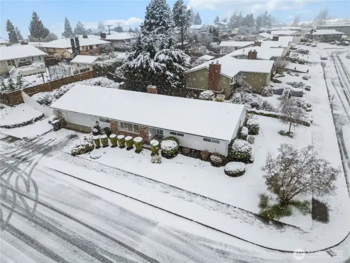 Situated on a large corner lot, this West End Tacoma home has ample parking, on and off street.