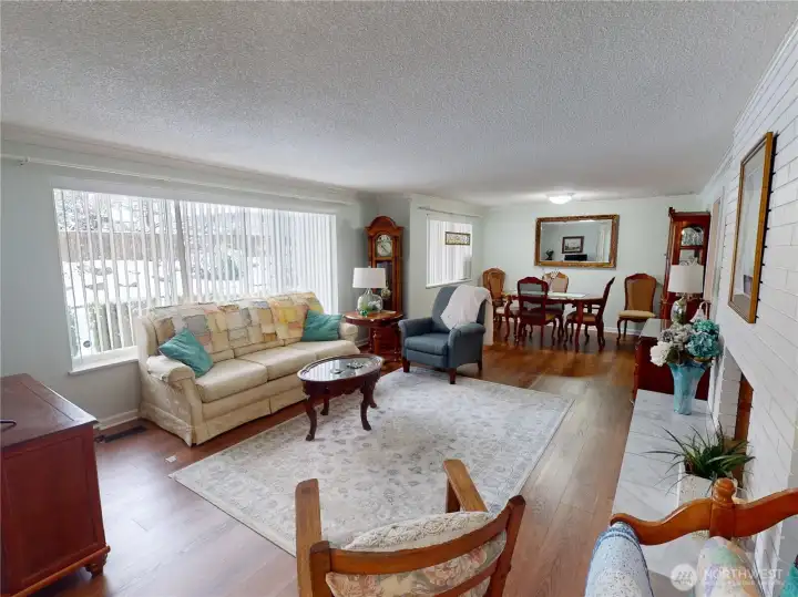 Living room and dining room/great room concept with access to the eat in kitchen and back yard.