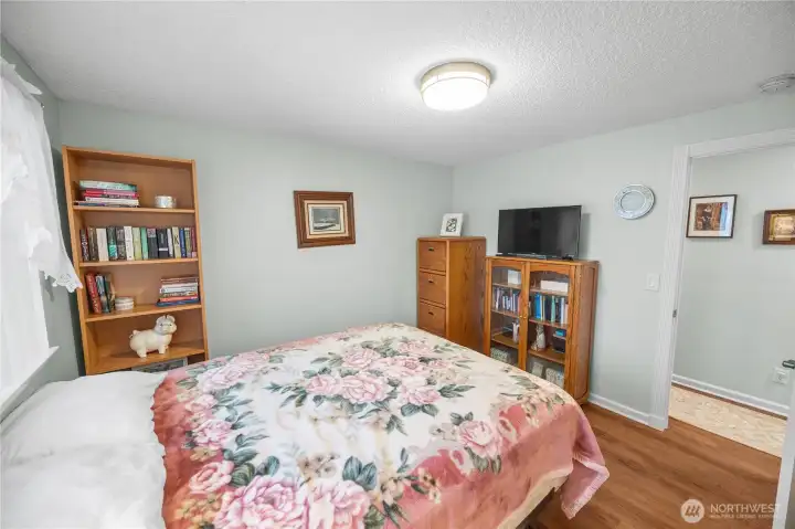 Bedroom number two features the same flooring found throughout the home (except for the bathrooms.)  Continuity in flooring is a must when maintaining a feeling of flow throughout a home.