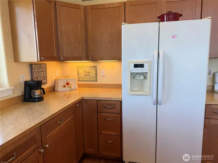 Under cabinet lighting adds to this charming home.