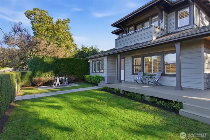 The patio is flanked with white Incredi-Ball hydrangeas which bloom with abandon summer through fall.