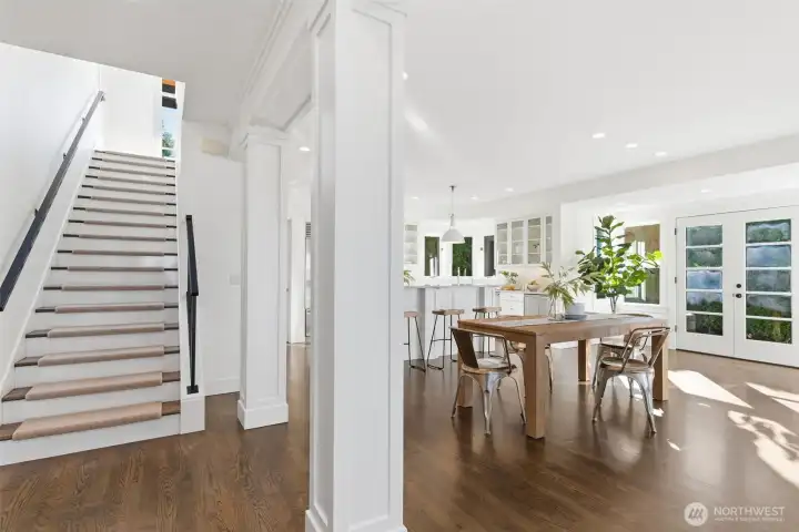 Hardwood staircase with white risers and easily removeable/re-attachable wool treads.