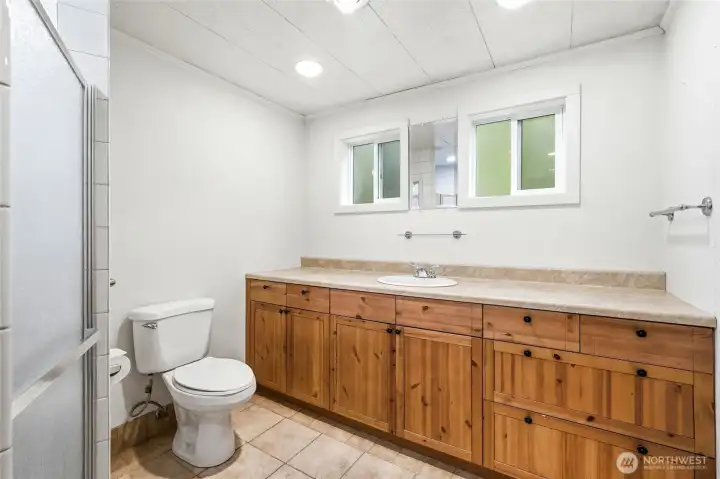 Bathroom with walk-in shower.