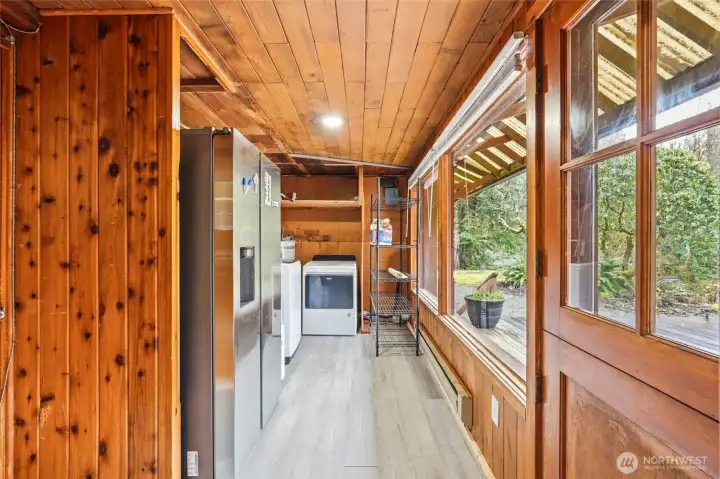 Laundry room with access to the Mudroom and backyard patio.