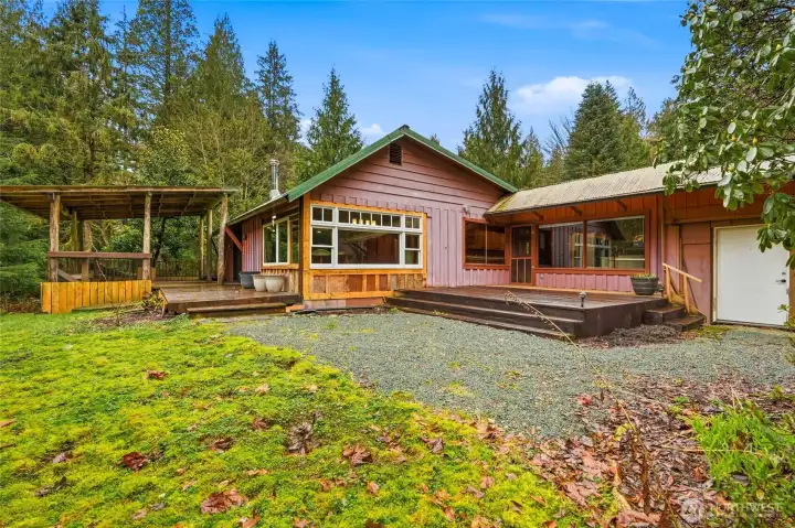 A covered deck overlooking French Creek & an oversized patio.