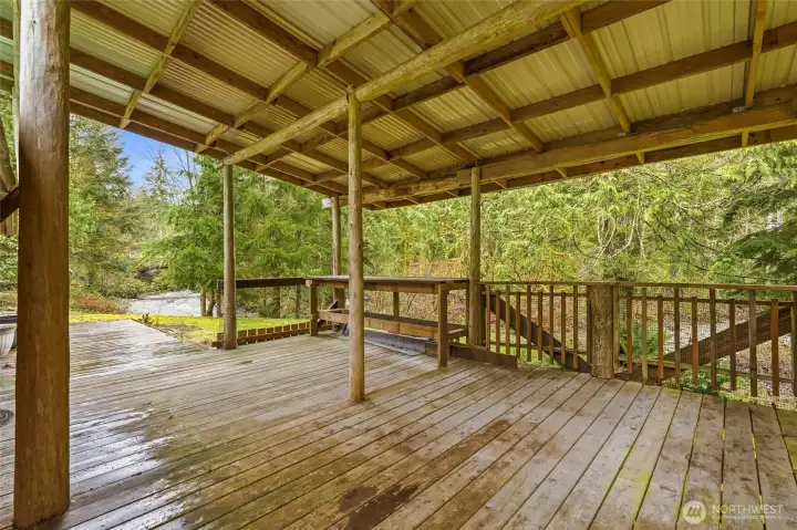The covered deck with built in bar seating.