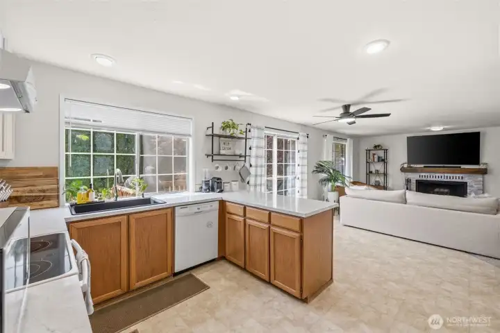 Bright kitchen overlooking the inviting family room