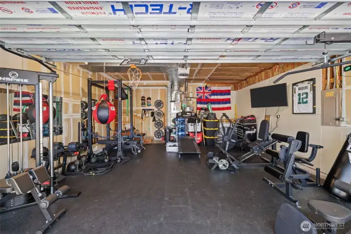 2-car garage currently set up as a home gym