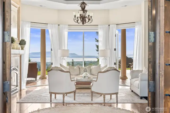 The home features rare 180 degree ocean, island, lake, mountain, and city views! With 11 patio and French doors, you can enjoy indoor/outdoor living seamlessly.