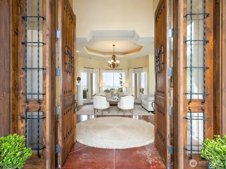 You are greeted with the water view upon entering the impressive   10 foot solid wood doors