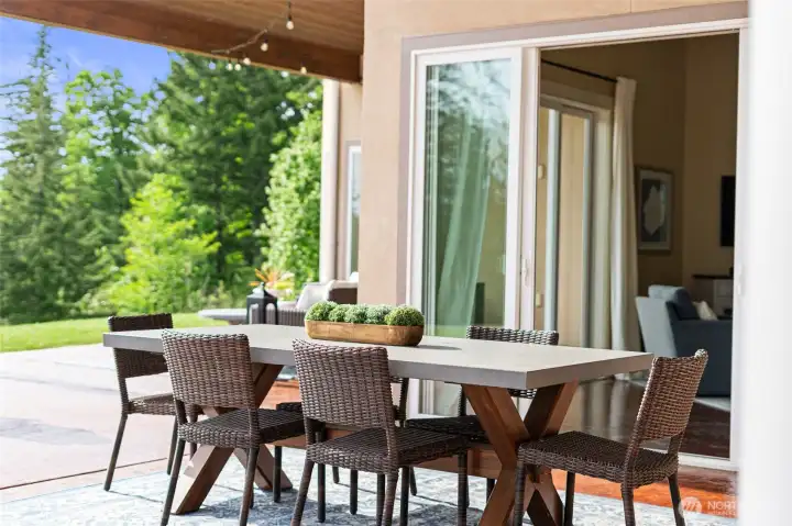 Covered dining area just outside the family room and kitchen. Perfect for alfresco dining.