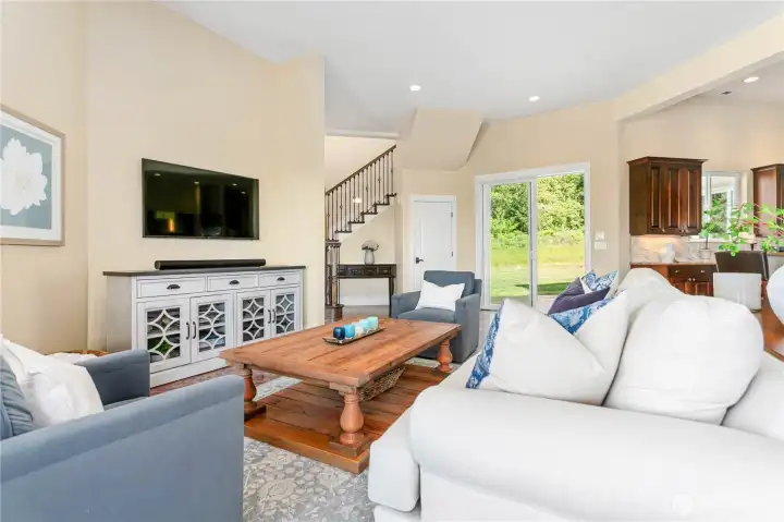Family room just off the kitchen. There is a second patio with speakers and a grilling area just outside the sliding glass door by the kitchen.