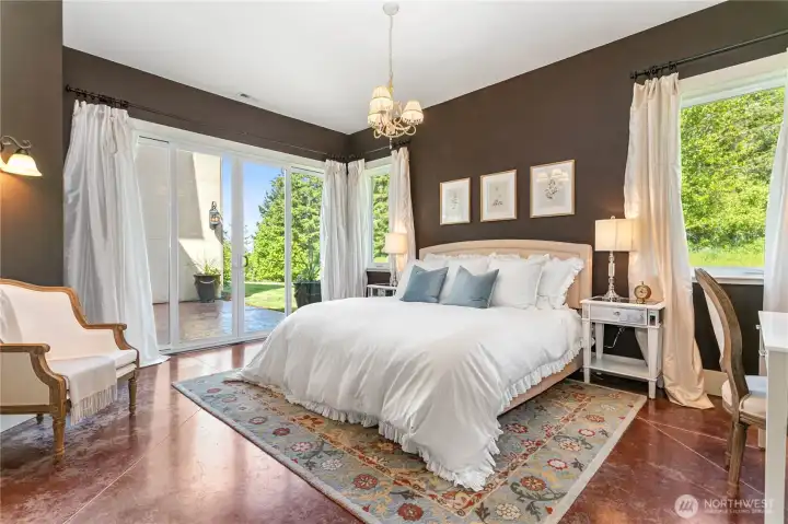Second primary suite with ensuite bathroom with a step-in shower and walk-in closet. There is an exterior patio door entrance. Great for guests or multi-generational living.