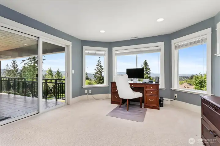 4th bedroom upstairs with walk in closet, ensuite 3/4 bath, and sliding door to the balcony