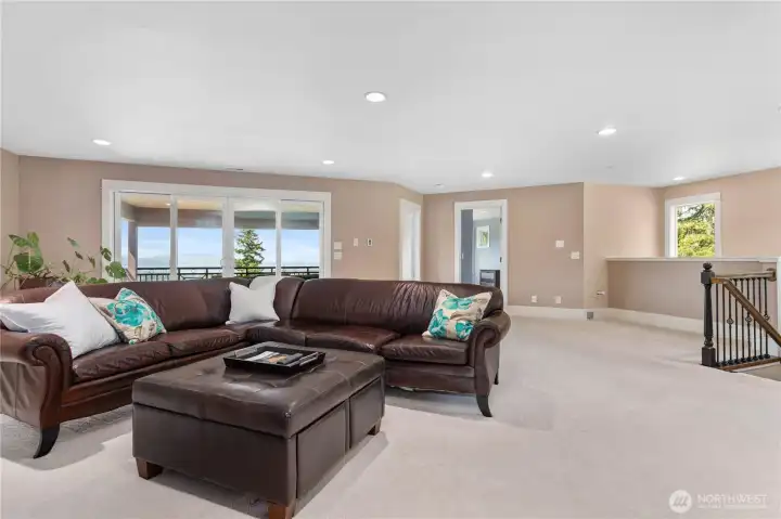 Spacious upstairs bonus room that is plumbed for a wet bar
