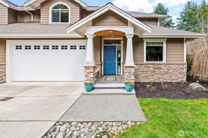 Front exterior of this end-unit townhome-style condo in Cherry Lane Estates, located in Gig Harbor. Private entrance, two-car garage, and beautifully maintained landscaping welcome you home. Front exterior of this end-unit townhome-style condo in Cherry Lane Estates, located in Gig Harbor. Private entrance, two-car garage, and beautifully maintained landscaping welcome you home.