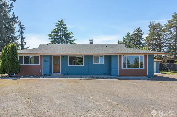 This is a special property with TWO remodeled ramblers, two detached garages and a large workshop on 2.1 scenic acres.