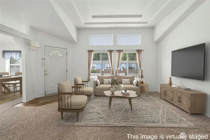 Newer carpet, high ceiling and transom windows letting in natural light.