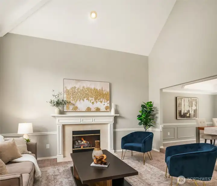 Living Room with Vaulted Ceilings, Floor to Ceiling Windows & Wood Burning Fireplace