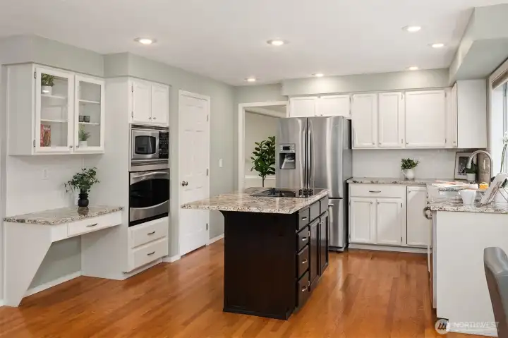Expansive Kitchen with Hardwood Floors, Center Island, Granite Counters