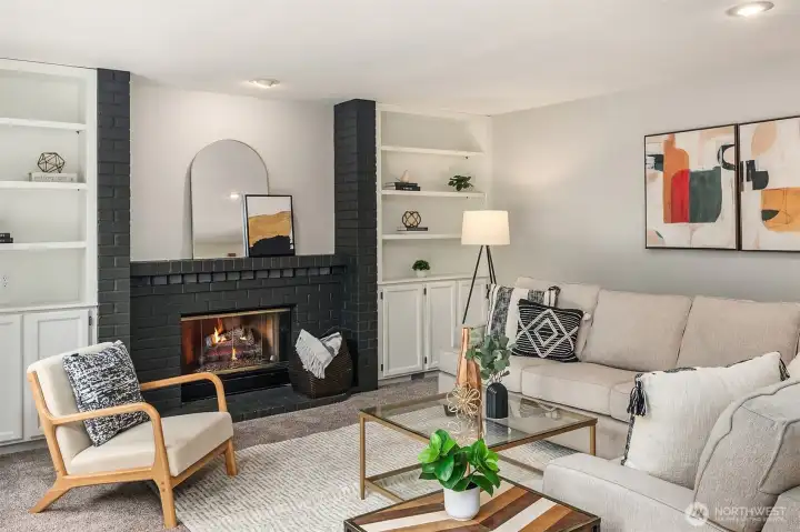 The Family Room Boasts Built-in Cabinets & a Wood Burning Fireplace