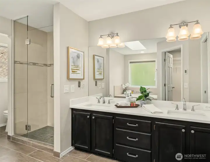 Spa Inspired Primary Bathroom with Heated Floors, Quartz Counters & Custom Glass Shower Door