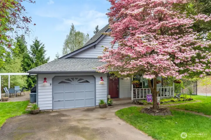 Sit on your covered porch or patio and enjoy the landscaped yard.