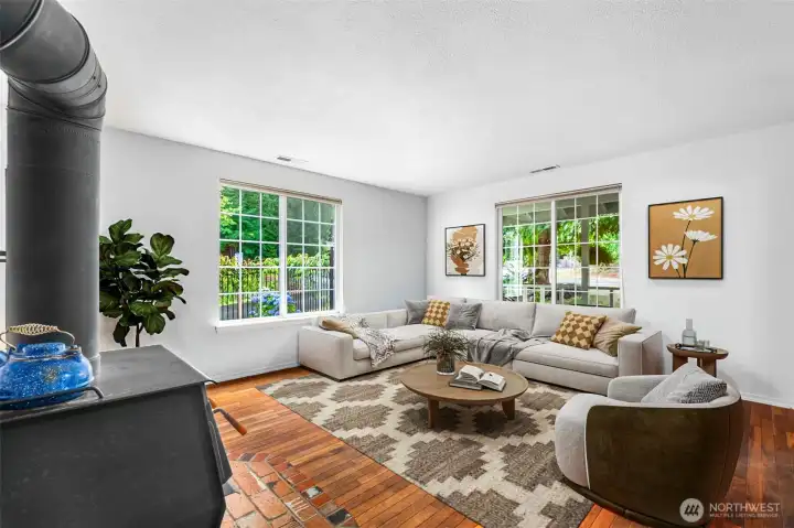 The front living room is nice and bright. This photo is virtually staged.